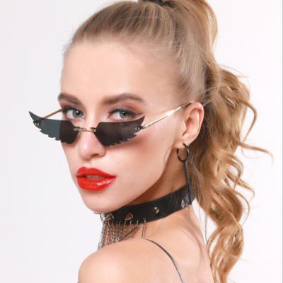 China 2022 Fashion Sunglasses Retro Vintage Style Frameless Crystal Gradient Feeling Small Wings Cut Out Sunglasses for sale