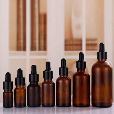 China Cosmetic in Amber Custom Colors Stock Ready to ship 1oz round lid twist cap black rubber head packaging dropper glass bottles for sale