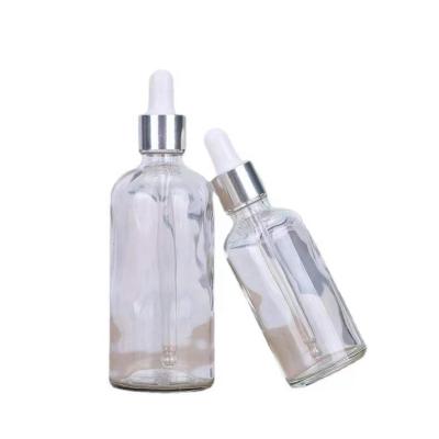 China Cosmetic Made In China Amber Blue Green 5ml-100ml Wholesale Clear Custom Glass Essential Oil Dropper Bottles Logo Round Metal Cap Serum for sale