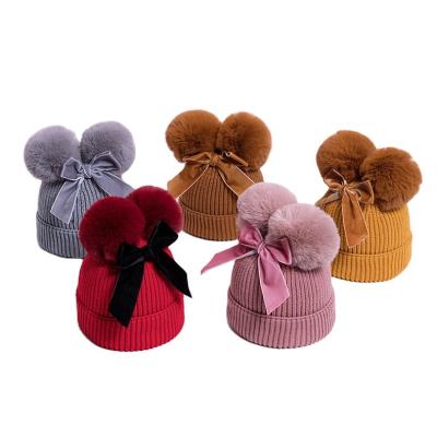 China COMMON double ball bowknot cute knit hat for baby for winter new style cotton baby warm hats for sale