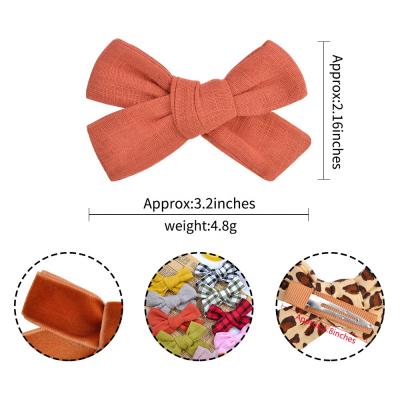 China Comfortable pure color lattice bow hair accessories cotton canvas fabric art children's small fresh candy color side clip for sale