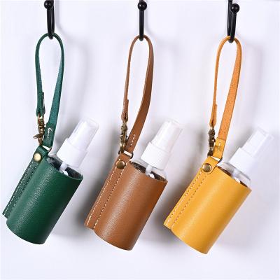 China Wholesale Travel PU Leather T-Type Travel PU Hand Sanitizer Portable Empty Hand Sanitizer Bottle Holder Packing Pouch With Key Chain for sale