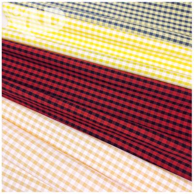 China New Design Double Faced Perforated Fabric Polyester Spandex Blended Elastic Yarn-dyed Grid Dress Shirt Fabric for sale