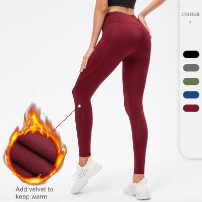 China Women's Breathable Autumn and Winter Plus Velvet Yoga Fitness Pants Warm High Waist Tight Pockets Running Exercise Pants for sale