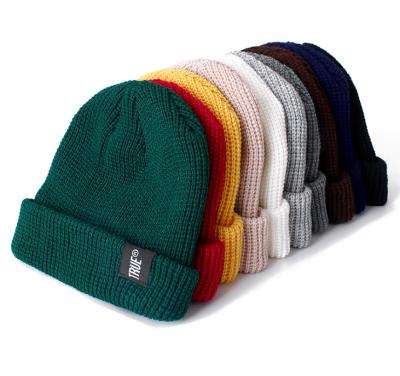 China COMMON Wholesale Candy Beanie Hat Rainbow Color Knitted Beanie Hat With Custom Private Labels Winter Hats for sale