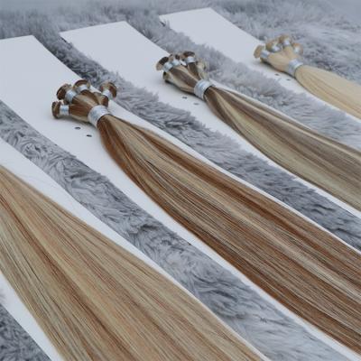 China Silky Wave Right Hand Tied 100 Raw Hair Extension Weft Sellers Cuticle Aligned 12A Raw Indian Hair for sale