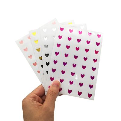 China Customized Waterproof+Eco-friendly Glossy Self Adhesive Vinyl Heart Shape Gold Foil Stamped Sheets Stickers for sale