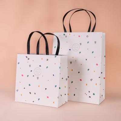 China Recyclable Promotional Boutique Thank You Clothes Folding Custom Paper Gift Packaging Bag for sale