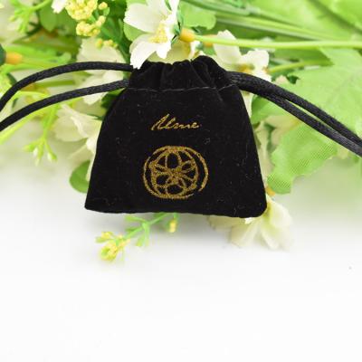 China Aseptic Chinese Product Sales Mini Black Velvet Jewelry Pouches With Gold Printing for sale