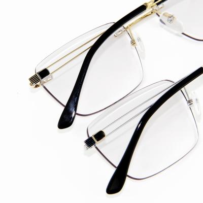 China Comfortable Rimless Titanium Line Eyeglasses High Quality Factory Wholesale Price Elegant Luxury Metal Optical Frame Screwless for sale