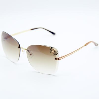 China 15 Years Experience Diamond Cut Titanium Nylon Lenses For Elegant And Beautiful Lady Rimless Oversized Sun Glasses for sale