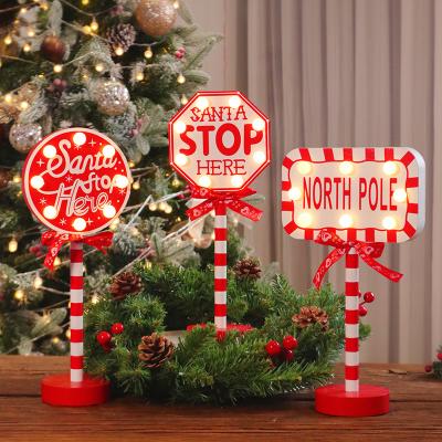 China Beautiful Santa Hat Crown Stop Road Sign Shape Xmas House Christmas Store Window Wooden Signs Led Light Decoration Table Lamp for sale