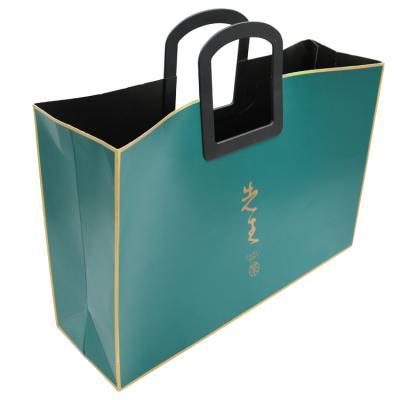 China Recyclable Paper Bags With Plastic Loop Die Cut Handle For Tea Drinks Gift Packaging for sale