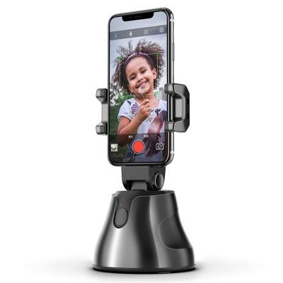 China Universal 360 Rotation AI Video Photo BT Auto Tracking Mobile Tik Tok Stand Phone Holder for sale