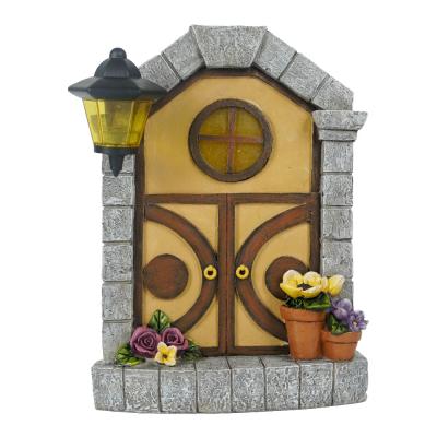 China With 2022 New Arrival Solar Craft Resin Garden Decor Magic Light Garden Gate With Solar Light for sale