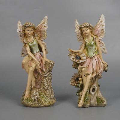 China Europe Wholesale New Arrive Garden Decor 2 Fairy Donkey Polyresin Angel Sitting Figurine With Wooden Base for sale