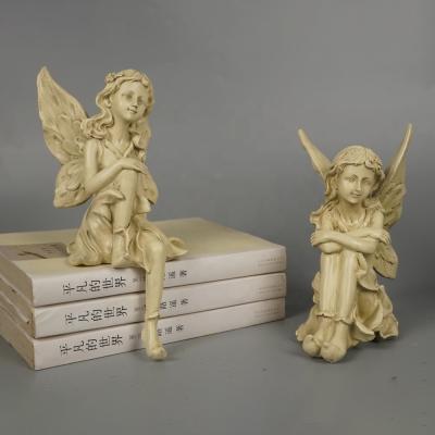 China Europe Garden Decor Small Size 2 Fairy Donkey Resin Angel Sitting Figurines for sale