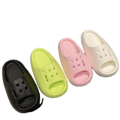 China Trend 2023 fashion spring and summer new thick push-up step on poo sense solid color sandals round heel flat main flip flops for sale