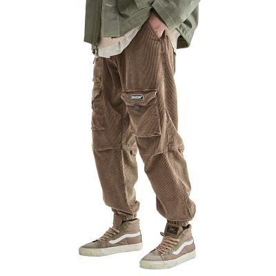 China New Design Men Corduroy Pants Solid Color Multi Pockets Harem Pants Viable Straight Loose Cargo Pants for sale