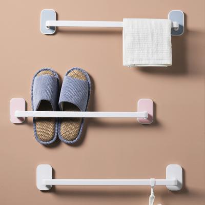 China Viable Waterproof Wall Mounted Sticker Hangs Bathroom Shelf Slippers Hanging Rack Towel Rack Storage Punchless for sale