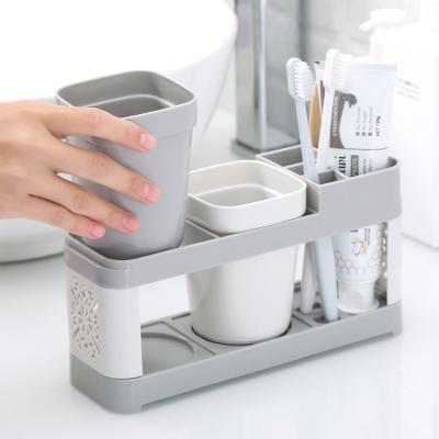 China Sustainable Household Daily Cleaning Counter Sink Couples Toothpaste Double Cup Toothbrush Holder Set for sale