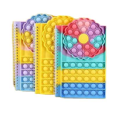 China Popular notebook A5 push bubble silicone decompression bubble toy pop it up spiral notebook for sale