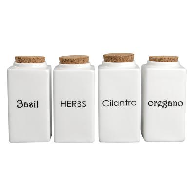 China Sustainable Wholesale White Kitchenware Sets 4 New Bone China Spice Jars Canister Set With Cork Stopper for sale