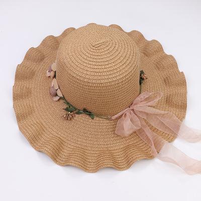 China New Summer Comfortable Fashion Designers Bow Knot Flower Brim Sun Visor Big Wavy Straw Sun Hat for sale