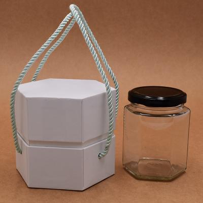 China Recycled materials wholesale fashion white color luxury candle hexagon paper box for cosmetics for sale