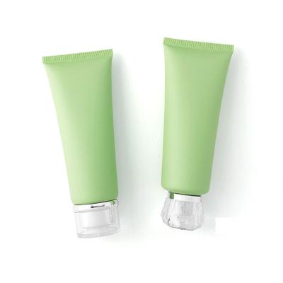 China Eco-friendly plastic tubes 100ml green cosmetic squeeze tube packaging for hand cream tube for sale