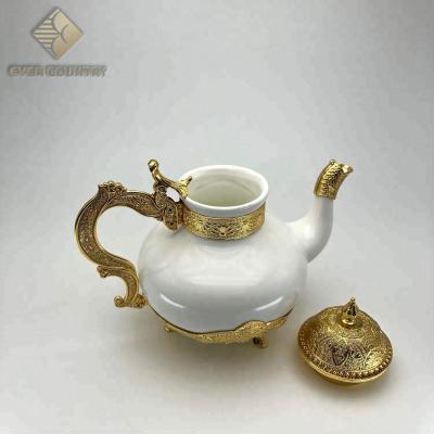 China Peacock Flower Desgin Drinkware Teapot Viable Ceramic Metal Set for sale