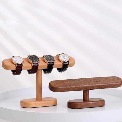 China Fashion Style Individuales Minimalist Black Walnut Watch Stand Nordic Simple Wood Jewelry Stand Solid Wood Supply Items for sale