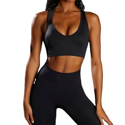 China Breathable fitness and yoga wear fashion criss cross sports bra high waisted seamless leggings sets for sale