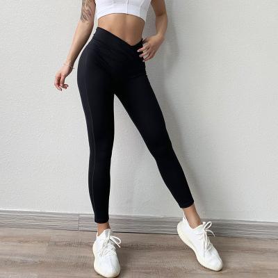 China Breathable Dropshipping Gym Use Women's Compression Cross Waist Leggings Fitness Fit White Slim Yoga Pants for sale