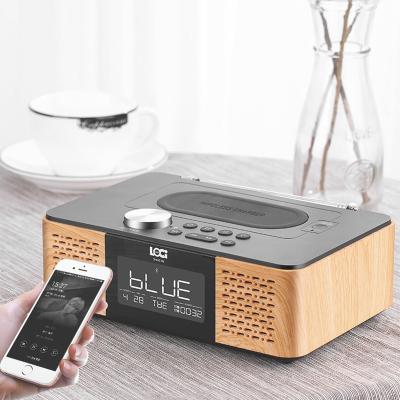 China BT wireless speaker with alarm clock /USB and TF card playback/FM radio/wireless charger for sale