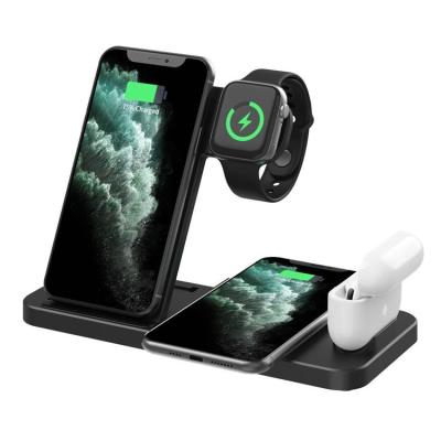 China Bestselling Multifunctional OEM 4 in 1 Foldable Fast Charger Stand 15W Qi Wireless Charging Stand for Cell Phone Smart Watch Earphones for sale