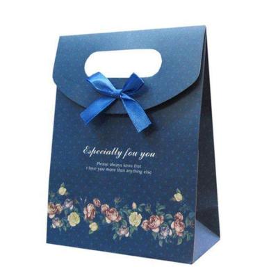 China Environmental eco material biodegradable flip cover top sealed gift paper bag with ribbon bowknot for sale