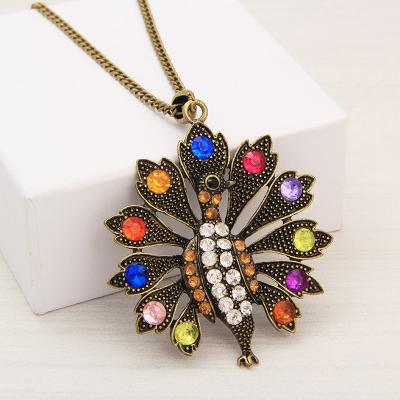 China Hiphop Vintage Gold Silver Open Screen And Vintage Diamond Peacock Long Pendant Women's Necklace for sale