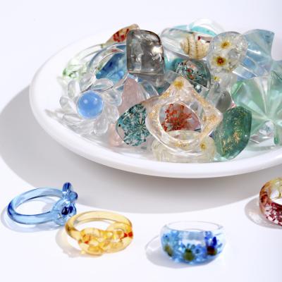 China 2021 New Environmental Friendly Handmade Resin Rings Embedded With Flower Plants Transparent Epoxy Rings for sale