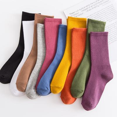 China Hot Selling Anti-Fault Solid Color Tube Socks Woman Hot Sale College Style OEM Japanese Cotton Socks for sale