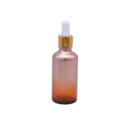 China Pink Gradient Color Essential Oil Packaging Cosmetic Glass Dropper Bottle for sale