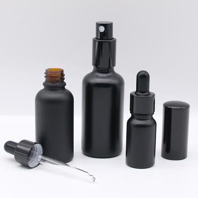 China Personal Care Essential Oil Bottle 30ml Black Frosted Bottle Glass for sale