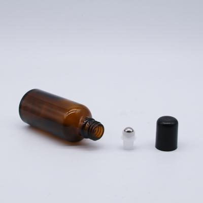 China Mini Roller Bottle 5ml 10ml Cosmetic Perfume Essential Oil Amber Glass Bottle With Trackball for sale