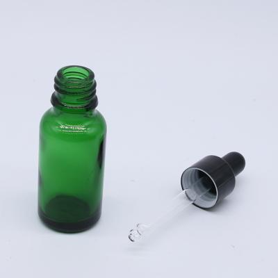 China Wholesale Custom Cosmetic Dropper Bottle Round 30ml 1oz Essential Oil Green Glass Bottle With Dropper Pipette for sale