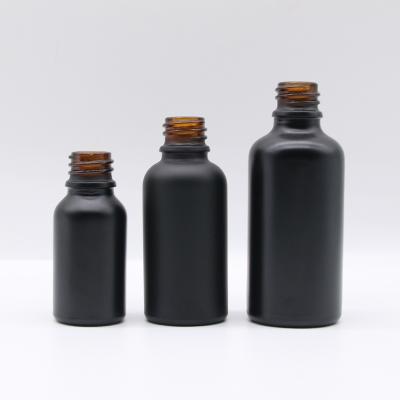 China Personal Care Factory Direct Hot Sale Essential Oil Bottle Black Frosted Bottle Glass for sale