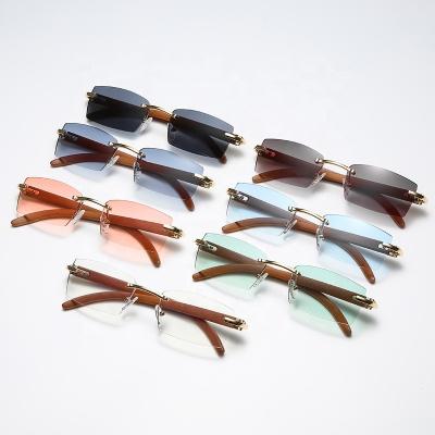 China Fashionable Luxury Travel Eyewear Gafas De Sol Charming Rectangle 2022 Wooden Sunglasses Rimless Glass Gradient Rimlss Sun Glass for sale