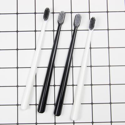 China Wholesale Custom Logo White Black Ultra Soft Fine Bristle Bamboo Charcoal Toothbrush For Adult for sale