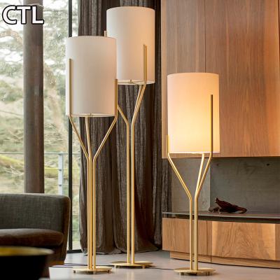 China Customized Modern Nordic Simple Hotel Desk Floor Lamps Home Decor Luxury Gold Standing Floor Lamp For Living Room for sale