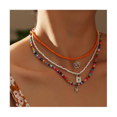 China FASHIONABLE Bohemian Colorful Rice Beads Flower Star Lock Choker Multi Layer Necklace For Women for sale