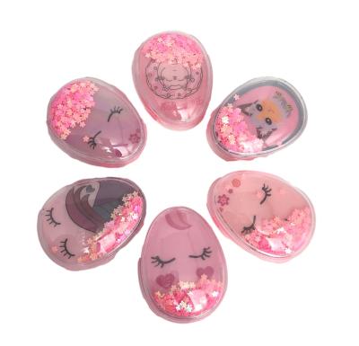 China Shiny Item Girls Hair Comb Mini Pink Egg Shape Cat Pattern Sakura Liquid Massage Air Cushion Comb Girls Hair Comb for sale